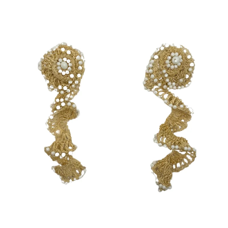 These stunning earrings feature a flower base with a lightning bolt shape above, symbolizing the power and softness of God's natural beauty and His Creation. Handmade with natural banana tree fibers, they are beautifully adorned with Murano stones around the flower base, creating a striking and unique design.
