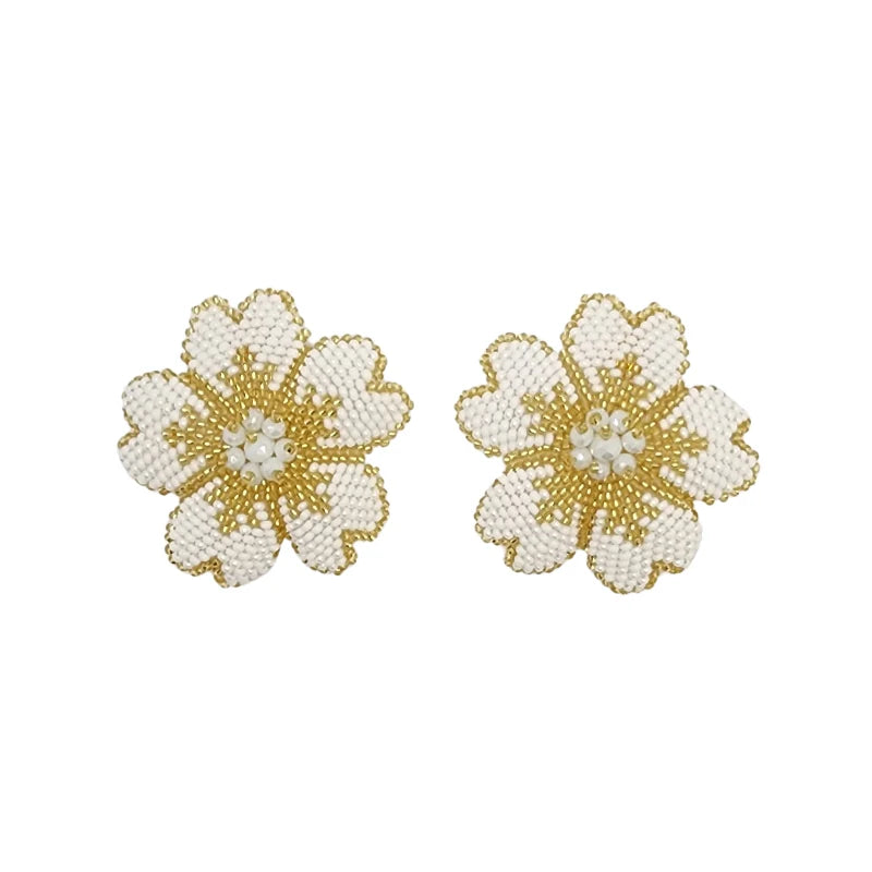 These intricately hand-beaded floral designs, crafted with white and gold beads, exude timeless elegance. Perfect as statement bridal jewelry, hair accessories, or unique embellishments, they add a romantic and sophisticated touch to any wedding look.