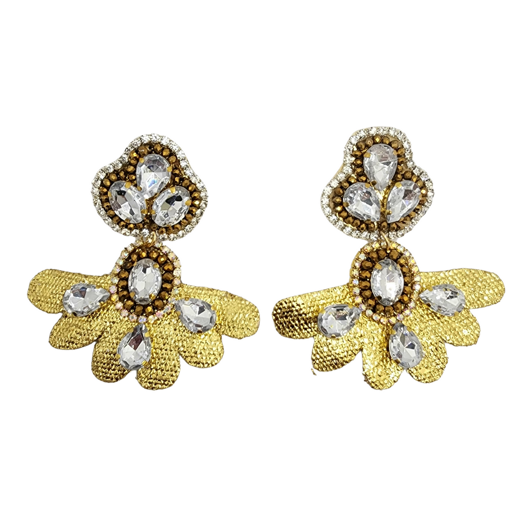 A pair of golden earrings with a floral design, adorned with sparkling crystal gemstones, displayed against a white background.