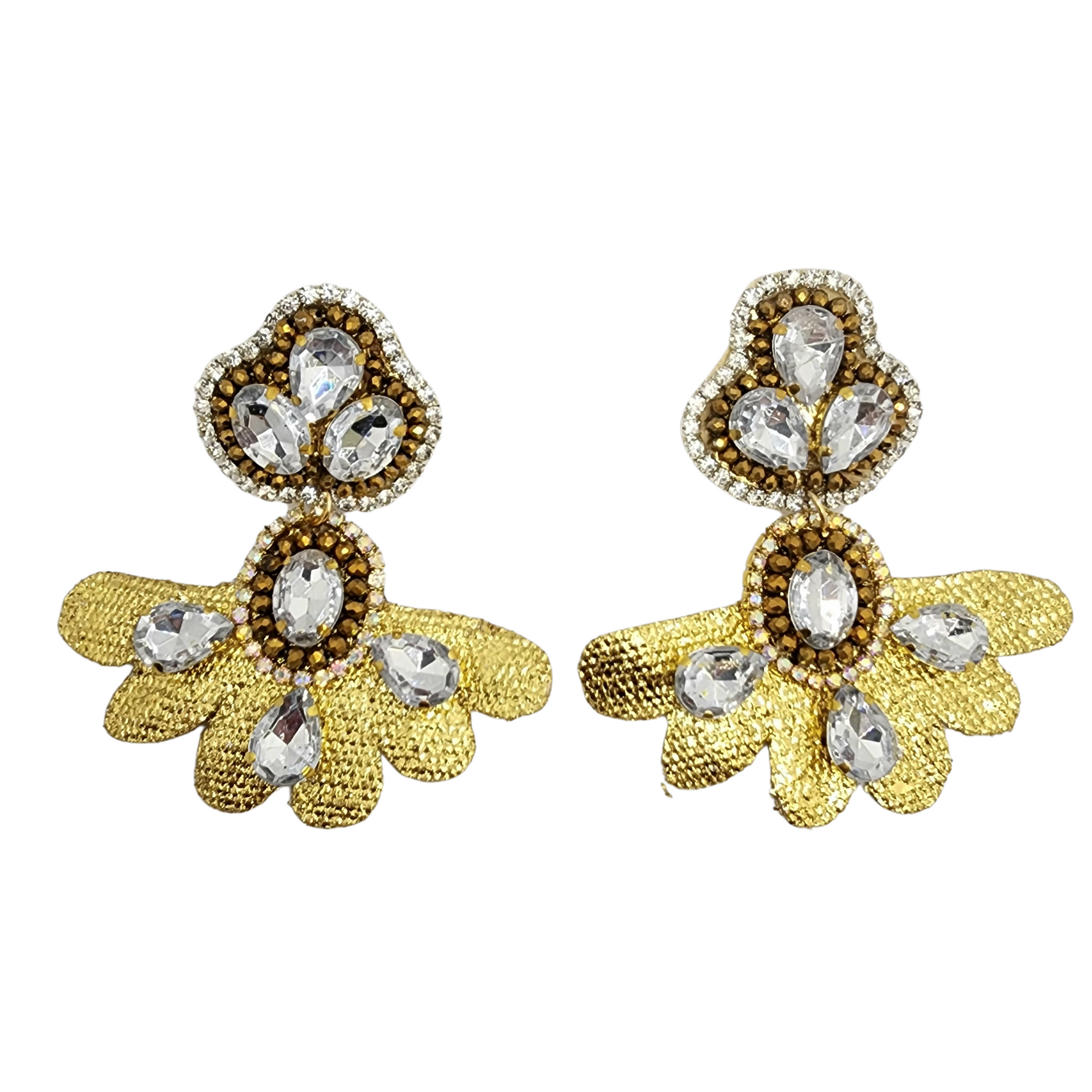 A pair of golden earrings with a floral design, adorned with sparkling crystal gemstones, displayed against a white background.