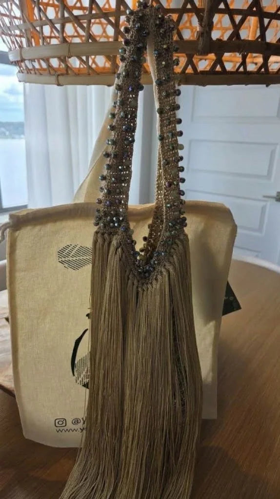 The Cascade Fringe Bag is a luxury handmade statement handbag designed for women who love timeless style, artisan craftsmanship, and one-of-a-kind fashion. Expertly handcrafted with elegant cascading fringe, this bag adds movement, texture, and sophistication to every outfit.