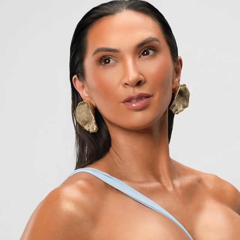 Make a bold fashion statement with these stunning sculptural earrings