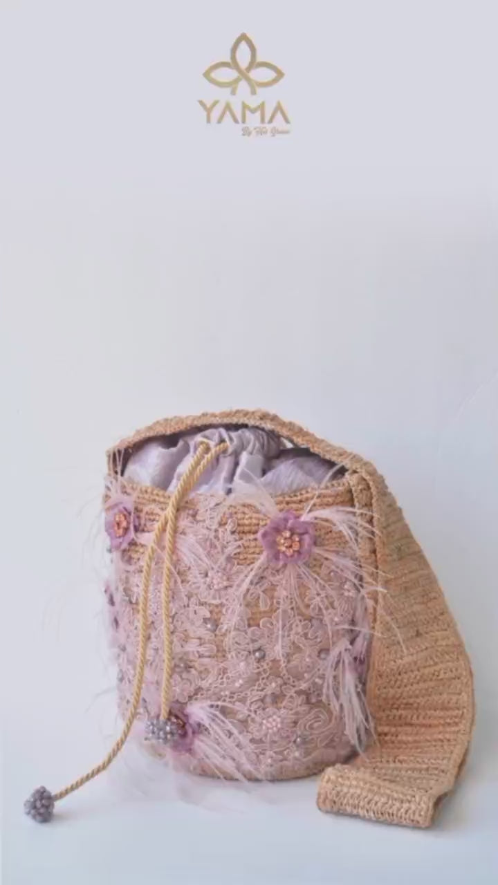 Lavender Embellished Bucket Bag showcased with floral lace, feathers, and crystals, highlighting its soft purple hue and handcrafted details