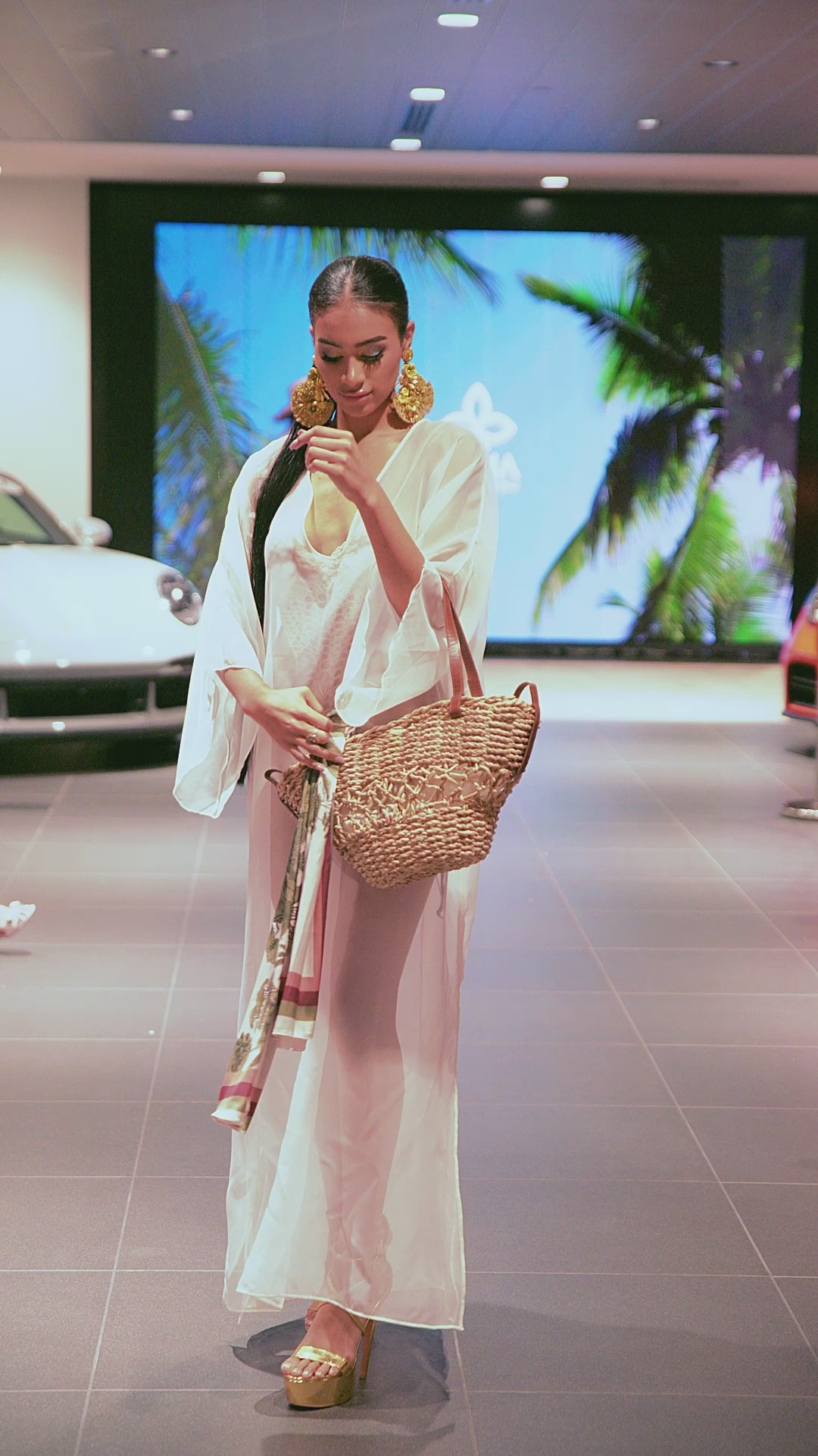 Video showcasing the Woven Campana Bag in medium and small sizes, highlighting its artisanal weave, leather handles, and beach-ready design from the Mommy & Me Collection by Yama by His Grace