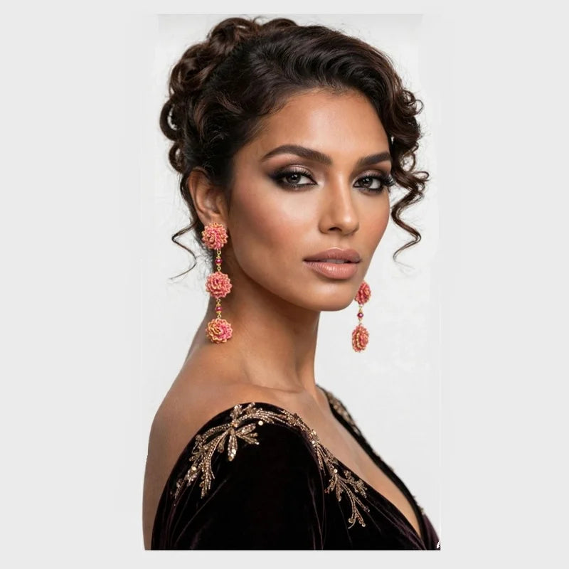 The Rosita Bloom Earrings capture the beauty of handcrafted artistry with a playful, feminine charm. Featuring three layered pink floral accents connected by delicate gold details, these earrings bring movement and joy to any look.