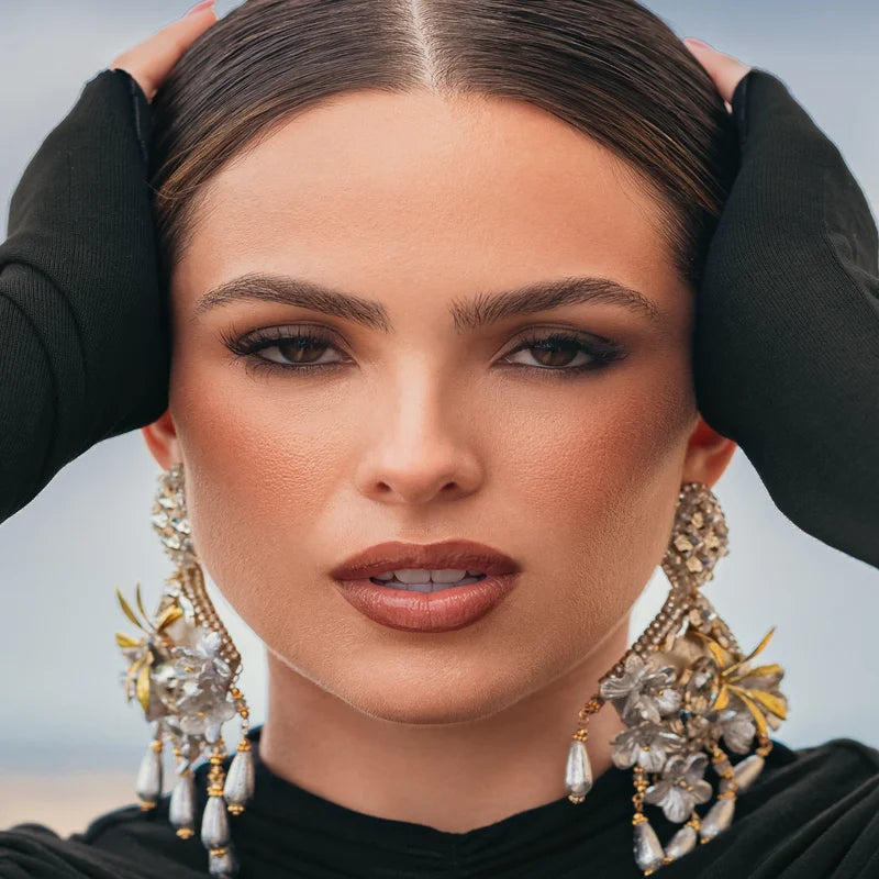 

Accented with silver teardrop details and transparent gemstones, they offer a refined blend of artisanal charm and modern elegance—perfect for any special occasion or stylish everyday look.